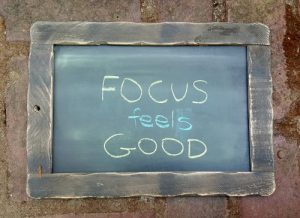 "Focus feels good" written on a chalkboard