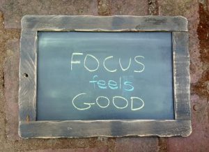 "Focus feels good" written on a chalkboard